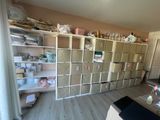 a room with a lot of boxes and shelves in it