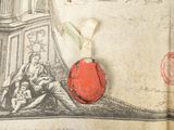 a red wax seal sitting on top of an old book