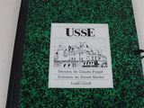 une image représentant un livre sur lequel figure l'illustration d'un bâtiment