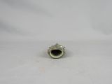 a small piece of metal that is sitting on a white surface