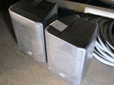two speakers that are sitting on a table