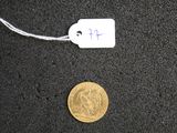 a gold coin with a price tag attached to it