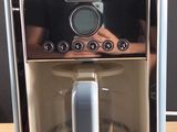 a coffee maker that is sitting on a wooden table