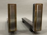 two metal bookends that are sitting on a table