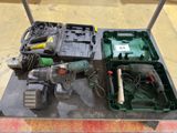 a box with a drill and other tools on a table