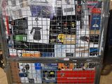 a metal cart with many items in it in a warehouse