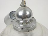 a silver light that is on top of a white table