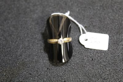 a ring that is sitting on top of a black object