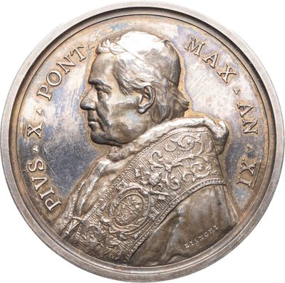 une image représentant une pièce d'argent sur laquelle figure le portrait d'un homme