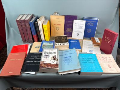 a lot of books that are sitting on a chair