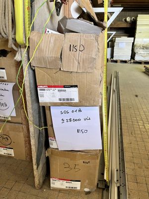 a pile of boxes with a lot of items on top of them