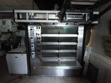 a commercial oven in the middle of a kitchen