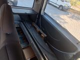 a view of a car ' s back seat with a drawer in it