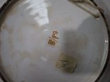 a close up of a plate with a tag on it