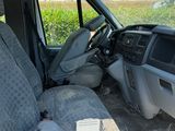 an image of a van with the front seats folded down