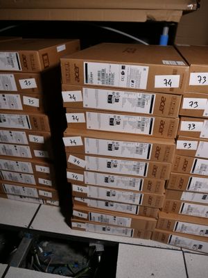 many boxes stacked on top of each other on the floor