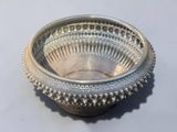 a silver bowl that is sitting on a table
