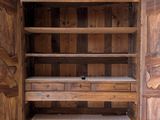 an image of a wooden cabinet with a door open on a white background