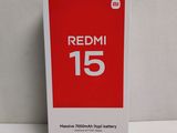 the redmi 15 battery box is open on a white surface