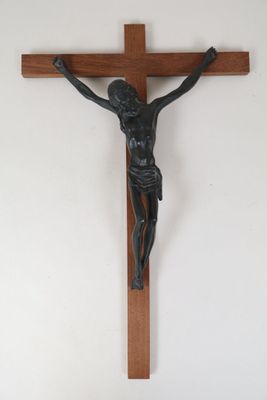 a statue of jesus on the cross hanging on the wall