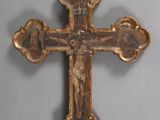 an old wooden cross with an image of jesus on it