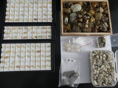 a box of rocks and a tray of rocks on a table