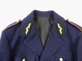 a close up of a blue military jacket with gold buttons