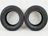 a pair of tires with a red background and the words vendu par lot de 2
