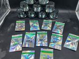 a pile of silver foil packets sitting on top of a black table