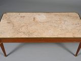 an image of a marble top coffee table on a grey background