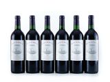 six bottles of wine are lined up in a row on a white surface