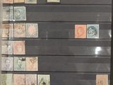 a picture of a display of stamps in a glass case