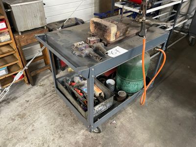 a workbench with tools on it in a garage