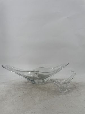 two clear glass bowls sitting on top of a white surface