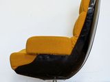 a black and yellow chair with a yellow cushion on it