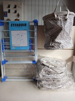 a stack of bags sitting on a shelf next to a ladder