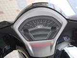 a close up of a speedometer on the handlebar of a motorcycle