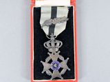 an image of a medal in a case with a ribbon around it