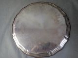 a silver plate that is sitting on a table