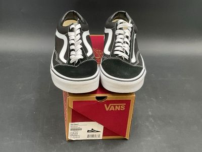 vans old skooler black and white sneakers in a box