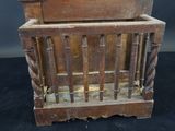 an old wooden crib with a baby ' s crib in it