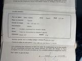 a document with a picture of a person holding a cell phone