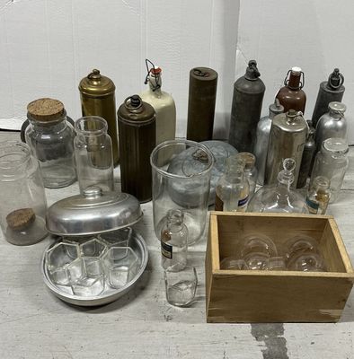 a lot of glass bottles and containers on the floor