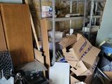 a pile of boxes and other items in a room