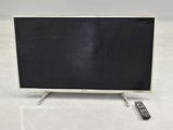 an image of a flat screen tv sitting on top of a white floor