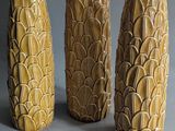 three vases that are sitting on a table