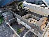 a car that is sitting on the back of a truck