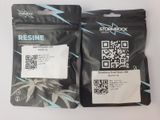 two bags of marijuana seeds with a qr code on them