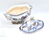 a blue and white bowl and a blue and white bowl on a white surface