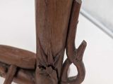 a close up of a wooden table with a candle on it